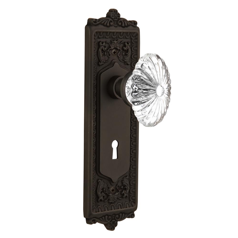 Nostalgic Warehouse EADOFC Privacy Knob Egg and Dart Plate with Oval Fluted Crystal Knob with Keyhole in Oil Rubbed Bronze